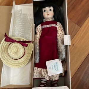 Porcelain Doll with Red Dress and Hat